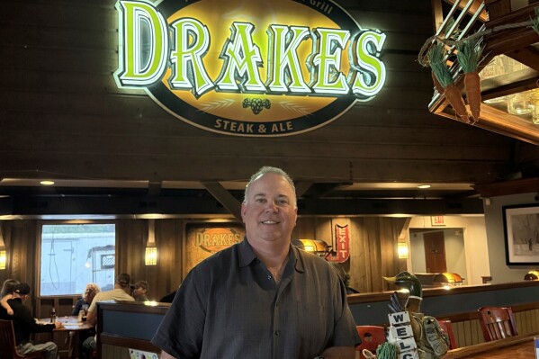 Tim Hart, an owner of Drakes Steak & Ale, stands inside the restaurant in Hannibal, Mo., on Friday, April 25, 2025. (Sydney Hart via AP)