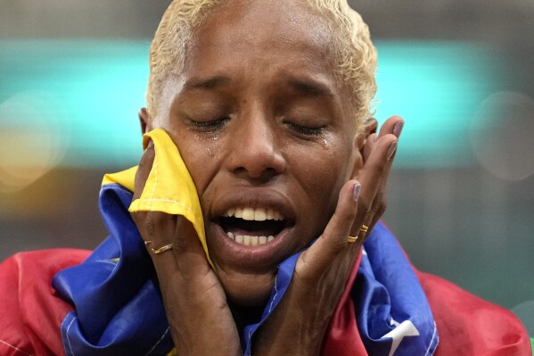 FILE - Yulimar Rojas, of Venezuela, reacts after winning the Women's triple jump final during the World Athletics Championships in Budapest, Hungary, Aug. 25, 2023. Rojas tore her left Achilles tendon and said on April 12, 2024 that she will miss the Paris Games. (AP Photo/Ashley Landis, File)