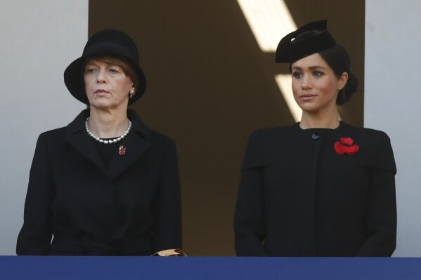 
              Meghan, Duchess of Sussex, right, and the wife of President of Germany Frank-Walter Steinmeier attend the Remembrance Sunday ceremony at the Cenotaph in London, Sunday, Nov. 11, 2018. Remembrance Sunday is held each year to commemorate the service men and women who fought in past military conflicts. 2018 marks the centenary of the armistice and cessation of hostilities in WWI, which ended on the eleventh hour of the eleventh day of the eleventh month,1918. (AP Photo/Alastair Grant)
            