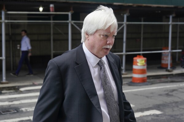 FILE - Trump Organization senior vice president and controller Jeffrey McConney returns to the courthouse after a break in the company's trial on Nov. 1, 2022, in New York. Former President Donald Trump has said he never thought his yearly financial statements “would be taken very seriously.” But evidence Thursday at his New York civil fraud trial showed the statements were integral to some of his business empire's loan deals. A state lawyer showed letters that former Trump company controller Jeffrey McConney sent to a bank, saying he was providing copies of Trump’s 2015 and 2016 financial statements as required under the conditions of a loan for his Seven Springs estate north of New York City. (AP Photo/Seth Wenig, File)