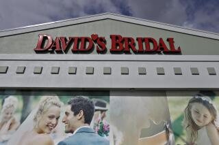 FILE - The David's Bridal shop is shown Nov. 19, 2018, in Tampa, Fla. David’s Bridal filed for bankruptcy protection Monday, April 17, 2023 the second time that the firm has sought such protection in the last five years. The announcement came just days after the company, one of the largest sellers of wedding gowns and formal wear, said it could be eliminating 9,236 positions across the United States. The Conshohocken, Pennsylvania-based retailer employs more than 11,000 workers, (AP Photo/Chris O'Meara, file)