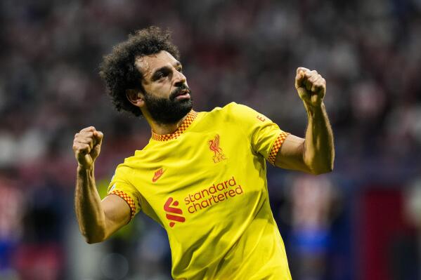Liverpool's Mohamed Salah celebrates after scoring a penalty shot during the Champions League Group B soccer match between Atletico Madrid and Liverpool at Wanda Metropolitano stadium in Madrid, Spain, Tuesday, Oct. 19, 2021. (AP Photo/Manu Fernandez)