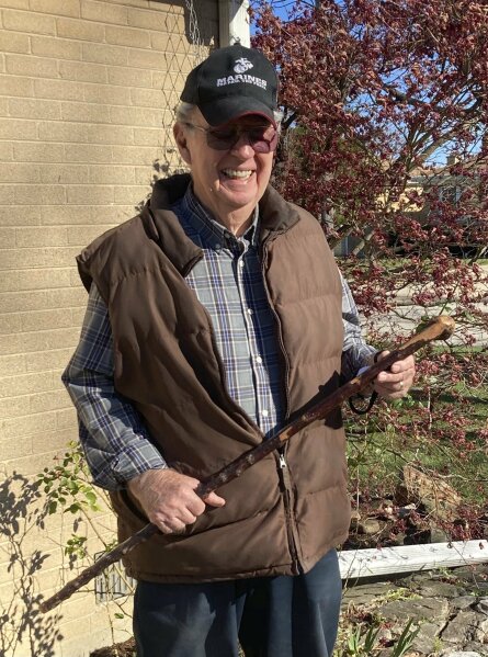 Dan Donovan holds the shillelagh, an Irish walking stick, that he used to chase intruders from his Niles home, Tuesday, Nov. 17, 2020 in Niles, Ill. Donovan, an 81-year-old former Marine from suburban Chicago used his grandfather's antique Irish walking stick to chase off three burglars and deliver one a thump in the head for his trouble.(Jennifer Johnson/Chicago Tribune via AP)