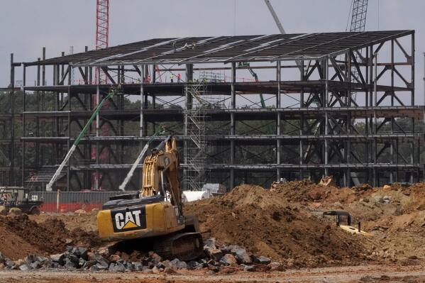 FILE - Construction personnel work on the Carolina Panthers' team headquarters and practice facility Aug. 24, 2021, in Rock Hill, S.C. The Panthers' proposed $800 million practice facility project in Rock Hill is officially dead after team owner David Tepper’s real estate company filed for Chapter 11 bankruptcy protection in Delaware on Wednesday night, June 1, 2022. (AP Photo/Chris Carlson, File)