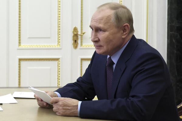 Russian President Vladimir Putin chairs a meeting on economic issues via teleconference call in Moscow, Russia, Monday, Sept. 12, 2022. (Gavriil Grigorov, Sputnik, Kremlin Pool Photo via AP)