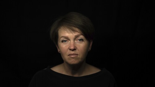 Olena Yahupova sits for a portrait in Zaporizhzhia, Ukraine, Thursday, May 18, 2023. Yahupova, a city administrator who was forced to dig trenches for Russian forces in Zaporizhzhia, says: 