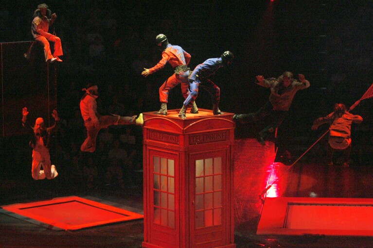 FILE - Acrobats perform during the preview of "Love," a new Beatles-themed Cirque du Soleil show, in Las Vegas, June 27, 2006. On Tuesday, April 9, 2024, it was announced that the final curtain will come down July 7 on Cirque du Soleil's long-running show “The Beatles Love," a cultural icon on the Las Vegas Strip that brought band members Paul McCartney and Ringo Starr back together for public appearances throughout its 18-year run. (AP Photo/Jae C. Hong, File)