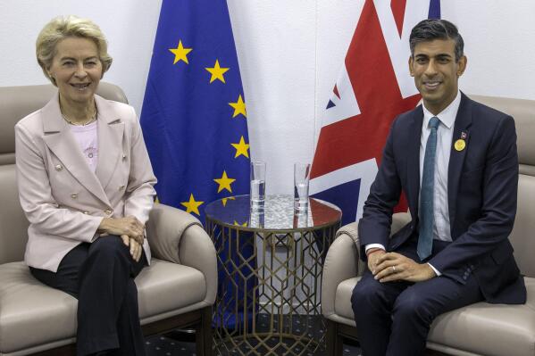 FILE - European Commission President Ursula von der Leyen, left, and British Prime Minister Rishi Sunak meet during the COP27 climate summit in Sharm el-Sheikh, Egypt, Nov. 7, 2022. British Prime Minister Rishi Sunak and European Union leader Ursula von der Leyen are due to meet, the two sides said Sunday Feb. 26, 2023, with expectations high they will seal a deal to resolve a thorny post-Brexit trade dispute. (Steve Reigate/Pool Photo via AP, File)