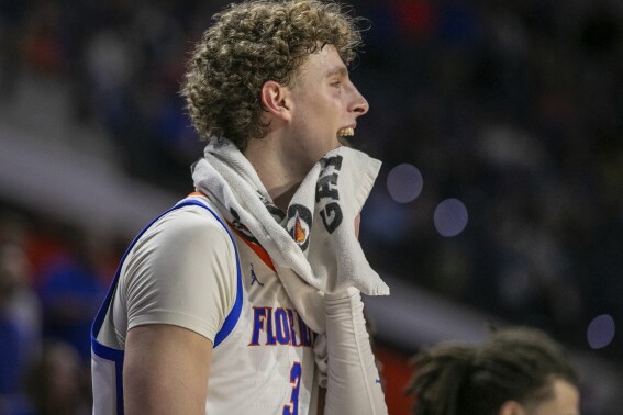 FILE - Florida center Micah Handlogten (3) anticipates the win during the second half of an NCAA college basketball game against Missouri Wednesday, Feb. 28, 2024, in Gainesville, Fla. Handlogten will take a year off to fully recover from a broken left leg suffered in the Southeastern Conference championship game last month. (AP Photo/Alan Youngblood, File)