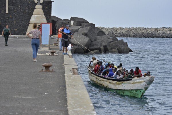 A small boat with migrants arrives at La Restinga on the Canary island of El Hierro, Spain, on Wednesday Oct. 4, 2023. EU conversations came as Spain's Marine Rescue service reported Friday Oct. 6, 2023 it had intercepted 262 migrants in three boats approaching the Canary Islands located off the northwest coast of Africa. This week alone, the seven-island archipelago's tiny El Hierro Island, which has a population of some 10,000, has taken in more than 1,200 migrants arriving in open wooden boats that are believed to have departed from Senegal. (Europa Press via AP)