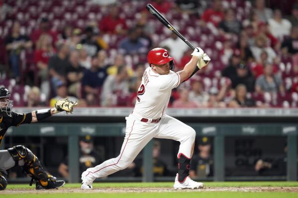 Cincinnati Reds' Brandon Drury, right, hits a triple during the seventh inning of the second baseball game of a doubleheader against the Pittsburgh Pirates, Thursday, July 7, 2022, in Cincinnati. (AP Photo/Jeff Dean)