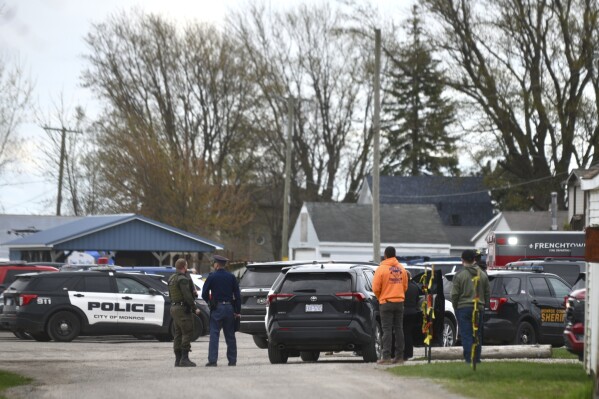 Authorities respond to the Swan Creek Boat Club after a driver crashed a vehicle through a building where a children's birthday party was taking place, Saturday, April 20, 2024, in Berlin Township, Mich. (Kathleen Kildee/Detroit News via AP)