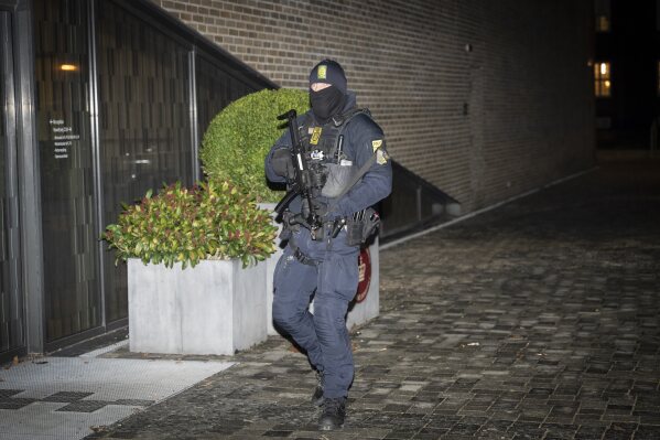 A Danish police stands before the court in Frederiksberg for the constitutional hearing, Thursday Dec. 14, 2023. Denmark is holding two people in custody and four others are the target of a terrorism investigation, a prosecutor said Friday, in a case that coincided with one arrest in the Netherlands and several in Germany of alleged Hamas members. (Emil Nicolai Helms/Ritzau Scanpix via AP)