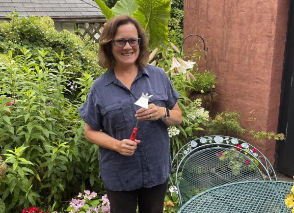 Elizabeth Licata, moderator of the Facebook group, WNY Gardeners, poses for a photograph on July 8, 2021 in Buffalo, N.Y. Moderating a Facebook gardening group is not without challenges. Facebook's algorithms sometimes flag the word " hoe" as "violating community standards," apparently referring to a different word, one without an "e" at the end that is nonetheless often misspelled as the garden tool. Licata said it has been futile trying to reach Facebook to correct the mistake.  (Elizabeth Licata via AP)