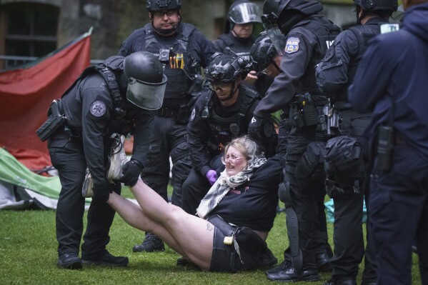 Police remove a protester on the University of Pennsylvania campus, in Philadelphia, on Friday, May 10, 2024. (Jessica Griffin/The Philadelphia Inquirer via AP)