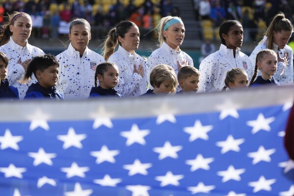 U.S. team sing their national anthem ahead of play in the Women's World Cup Group E soccer match between the United States and the Netherlands in Wellington, New Zealand, Thursday, July 27, 2023. (AP Photo/John Cowpland)