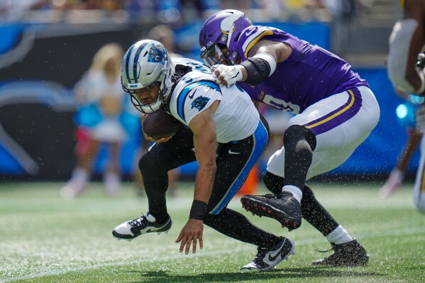 Carolina Panthers quarterback Bryce Young is sacked by Minnesota Vikings linebacker Marcus Davenport during the second half of an NFL football game Sunday, Oct. 1, 2023, in Charlotte, N.C. (AP Photo/Rusty Jones)