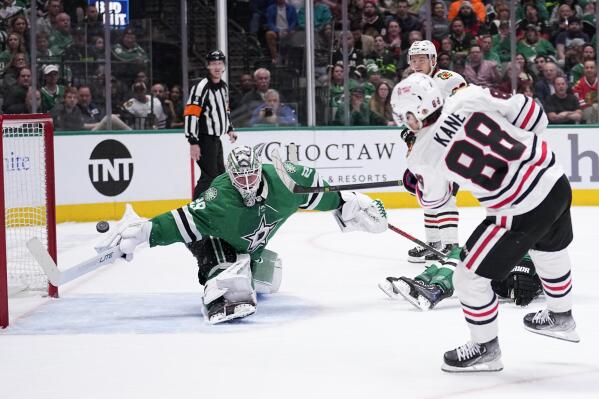 Chicago Blackhawks right wing Patrick Kane (88) scores against Dallas Stars goaltender Jake Oettinger (29) in the second period of an NHL hockey game, Wednesday, Feb. 22, 2023, in Dallas. (AP Photo/Tony Gutierrez)