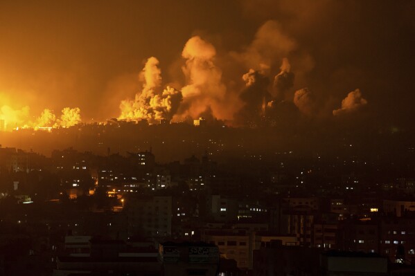 Fire and smoke rise following an Israeli airstrike in Gaza City, Sunday, Oct. 8, 2023. (AP Photo/Fatima Shbair)