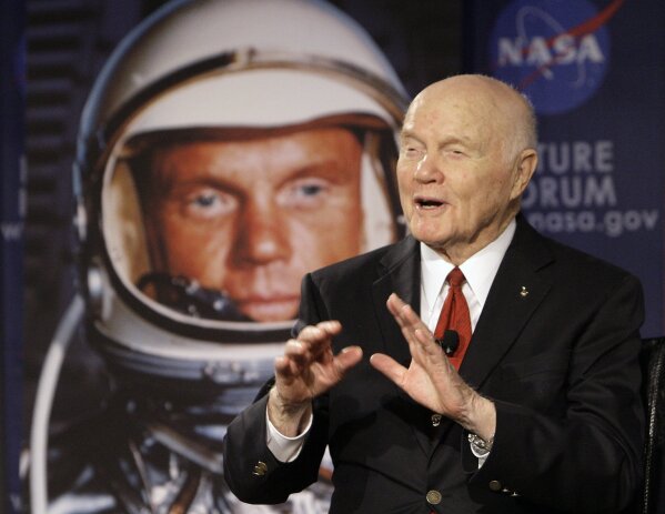 FILE - In this Feb. 20, 2012, file photo, U.S. Sen. John Glenn talks with astronauts on the International Space Station via satellite before a discussion titled "Learning from the Past to Innovate for the Future" in Columbus, Ohio. A panel is scheduled to vote Thursday, Feb. 25, 2021 on bringing a statue of the late astronaut and U.S. Sen. John Glenn to the Ohio Statehouse to mark major future milestones, such as his birthday and the anniversary of his famous space flight. Glenn died in 2016 at age 95. (AP Photo/Jay LaPrete, File)