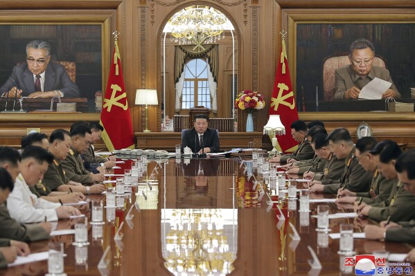 In this undated photo provided by the North Korean government, North Korean leader Kim Jong Un, center, attends a meeting of the North Korean ruling Workers’ Party’s central military commission in Pyongyang, North Korea Wednesday, Aug. 9, 2023. Independent journalists were not given access to cover the event depicted in this image distributed by the North Korean government. The content of this image is as provided and cannot be independently verified. Korean language watermark on image as provided by source reads: 