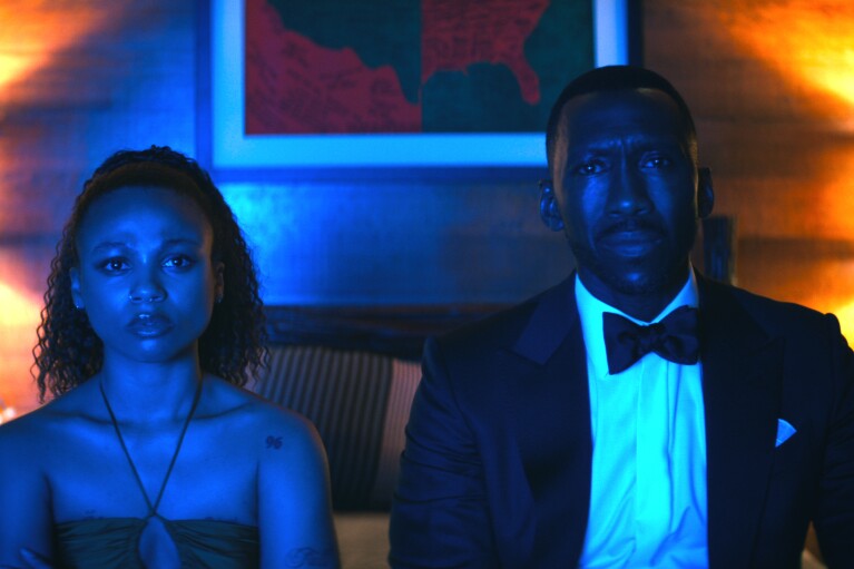 This image released by Netflix shows Myha'la Herrold as Ruth and Mahershala Ali in a scene from "Leave the World Behind." (Netflix via AP)