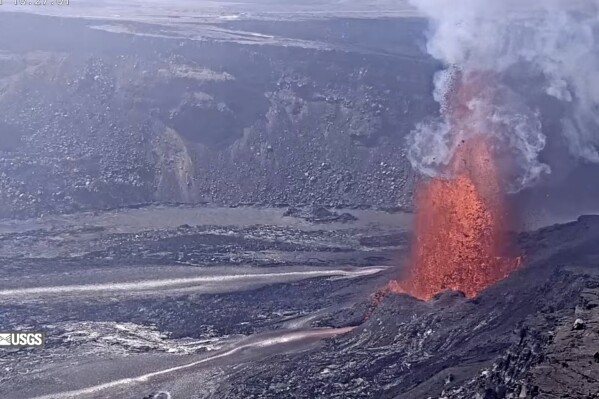 This image from webcam footage provided by the United States Geological Survey (USGS) shows lava fountains shooting up high in the latest episode of an ongoing eruption of Kilauea volcano inside Hawaii Volcanoes National Park on Tuesday, March 11, 2025 (United States Geological Survey via AP)