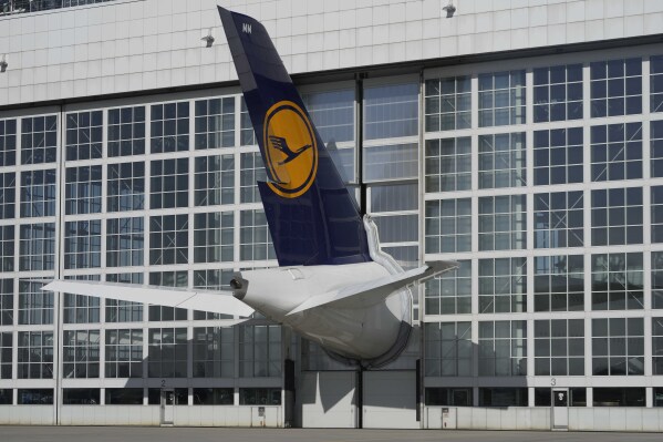 FILE - A Lufthansa aircraft is parked at the airport in Munich, Germany, Thursday, Feb. 15, 2024. Two German unions on Monday again called on their members — German airline Lufthansa's ground staff and German rail operator's Deutsche Bahn train drivers — to go on strike this week following ongoing negotiations over wages and working conditions. Thousands of flights and trains are expected to be canceled Thursday and Friday — the two days that German train drivers’ union GDL and Ver.di called for the strikes. (AP Photo/Matthias Schrader, File)