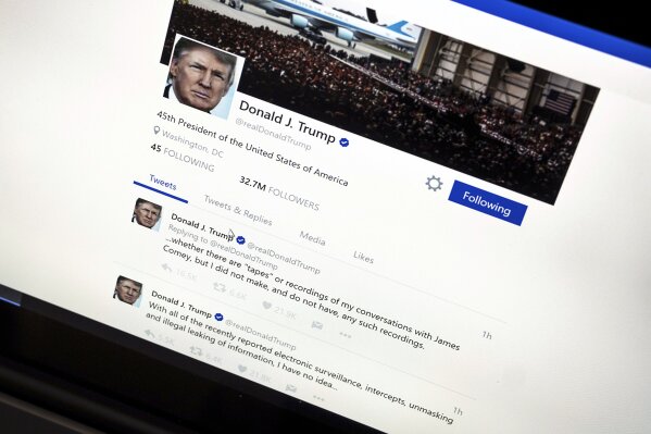 
              In this June 22, 2017, photo, President Donald Trump's Twitter page with his tweets about not recording his conversations with former FBI Director James Comey is photographed in Washington. The Trump administration’s mastery of the online world notably doesn’t extend to Spanish-language content. It never replaced the Spanish portion of the White House website; its Spanish Twitter account is peppered with English and features abundant typos; and there appears to be little outreach to a demographic that rejected Trump by an overwhelming margin. (AP Photo/J. David Ake)
            