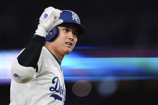 Los Angeles Dodgers' Shohei Ohtani celebrates after hitting a three-run home run during the third inning of a baseball game against the Athletics, Thursday, May 15, 2025, in Los Angeles. (AP Photo/Mark J. Terrill)