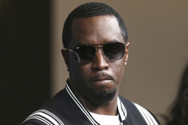 FILE - In this May 30, 2018, file photo, Sean "Diddy" Combs arrives at the LA Premiere of "The Four: Battle For Stardom" at the CBS Radford Studio Center in Los Angeles. Combs' lawyer said Tuesday, March 26, 2024, that the searches of his Los Angeles and Miami properties by federal authorities in a sex-trafficking investigation were ”a gross use of military-level force" and that Combs is “innocent and will continue to fight" to clear his name. (Photo by Willy Sanjuan/Invision/AP, File)