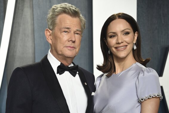 FILE - David Foster, left, and Katharine McPhee arrive at the Vanity Fair Oscar Party on Feb. 9, 2020, in Beverly Hills, Calif. The couple, who wed in 2019, have welcomed a baby boy, McPhee's publicist confirmed Wednesday, Feb. 24, 2021. (Photo by Evan Agostini/Invision/AP, File)