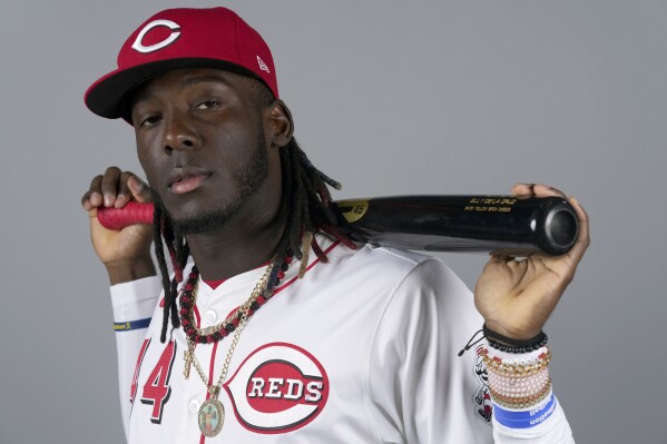Cincinnati Reds infielder Elly De La Cruz poses for a photograph with his bat on the team's photo day during baseball spring training Tuesday, Feb. 20, 2024, in Goodyear, Ariz. (AP Photo/Ross D. Franklin)
