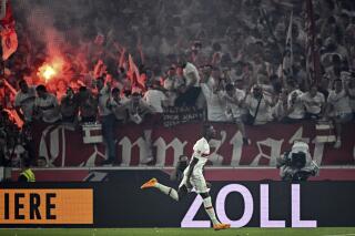 Stuttgart's Serhou Guirassy celebrates after scoring the third goal of the game during the first leg of the German Bundesliga relegation soccer match between Stuttgart and Hamburger at the Mercedes-Benz Arena in Stuttgart, Germany, Thursday, June 1, 2023. (Tom Weller/dpa via AP)