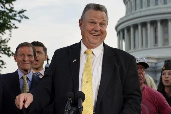 FILE - Sen. Jon Tester, D-Mont., speaks at a news conference alongside Sen. Richard Blumenthal, D-Conn., back left, on Aug. 2, 2022, on Capitol Hill in Washington. Libertarians lined up with Democrats on Friday against a proposal that would effectively block out third party candidates from next year's Montana U.S. Senate election. Republicans are trying to consolidate opposition to incumbent Jon Tester in a race that's pivotal for control of the the Senate. (AP Photo/Patrick Semansky, File)