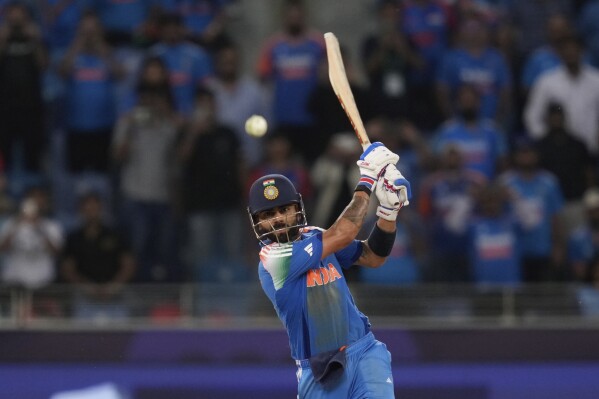 India's Virat Kohli hits winning runs during the ICC Champions Trophy cricket match between India and Pakistan at Dubai International Cricket Stadium, United Arab Emirates, Sunday, Feb. 23, 2025. (AP Photo/Altaf Qadri)