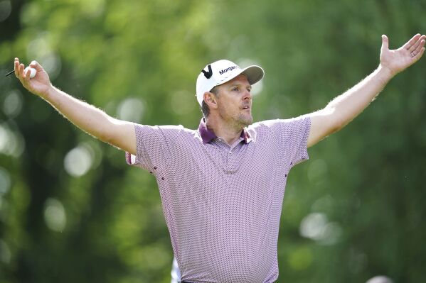 England's Justin Rose reacts after teeing off the 17th during day one of the Betfred British Golf Masters in Sutton Coldfield, England, Thursday, June 29, 2023. (David Davies/PA via AP)
