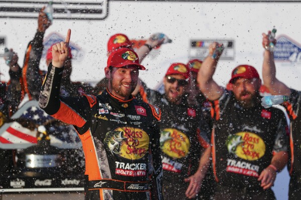 Chase Briscoe celebrates in Victory Lane after winning a NASCAR Cup Series auto race at Pocono Raceway, Sunday, June 22, 2025, in Long Pond, Pa. (AP Photo/Derik Hamilton)