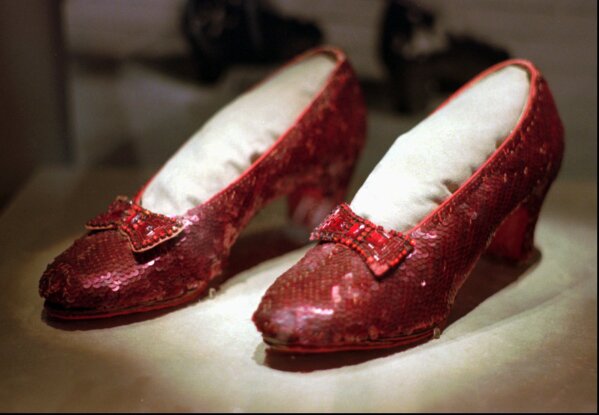 
              FILE - This April 10, 1996, file photo shows one of the four pairs of ruby slippers worn by Judy Garland in the 1939 film "The Wizard of Oz" on display during a media tour of the "America's Smithsonian" traveling exhibition in Kansas City, Mo. Federal authorities say they have recovered a pair of ruby slippers worn by Garland that were stolen from the Judy Garland Museum in Grand Rapids, Minn., in August 2005 when someone went through a window and broke into the small display case. The shoes were insured for $1 million. (AP Photo/Ed Zurga, File)
            