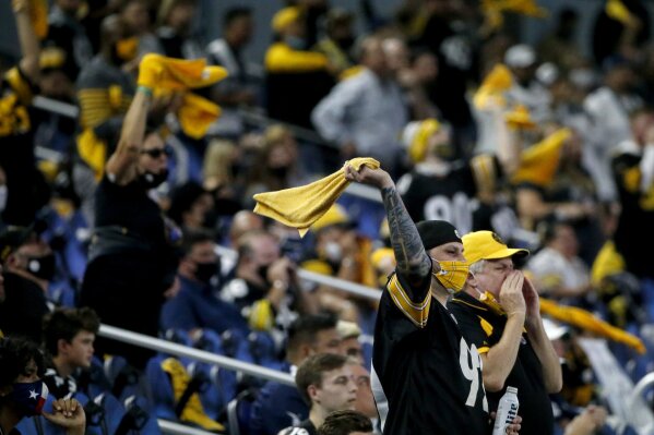 Pittsburgh Steelers fans cheer on their team late in the second half of an NFL football game against the Dallas Cowboys in Arlington, Texas, Sunday, Nov. 8, 2020. (AP Photo/Michael Ainsworth)