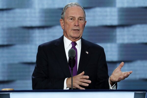 FILE - In this July 27, 2016, file photo, former New York City Mayor Michael Bloomberg speaks during the third day of the Democratic National Convention in Philadelphia.  With Bloomberg now running for president, the news service that bears his name said Sunday, Nov. 24, 2019,  it will not “investigate” him or any of his Democratic rivals, and Bloomberg Opinion will no longer run unsigned editorials. (AP Photo/J. Scott Applewhite, File)