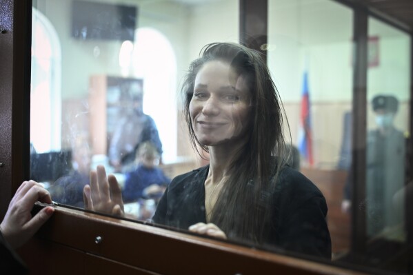 Antonina Favorskaya stands in a glass cage in a courtroom in the Basmanny District Court in Moscow, Russia, Friday, March 29, 2024. A court in Moscow makes a decision on measure of restrain to journalist Antonina Favorskaya in the case of her connection with the FBK, the Anti-Corruption Foundation set up by Russian opposition leader Alexei Navalny in 2011 and declared extremist and closed in 2021. (AP Photo/Dmitry Serebryakov)