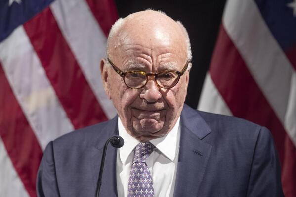FILE - Rupert Murdoch introduces Secretary of State Mike Pompeo during the Herman Kahn Award Gala, Oct. 30, 2019, in New York. A defamation lawsuit against Fox News is revealing blunt behind-the-scenes opinions by its top figures about Donald Trump, including a Tucker Carlson text message where he said “I hate him passionately.” Carlson's private conversation was revealed in court papers at virtually the same time as the former president was hailing the Fox News host on social media for a “great job” for using U.S. Capitol security video to produce a false narrative of the Jan. 6, 2021, insurrection. (AP Photo/Mary Altaffer, File)