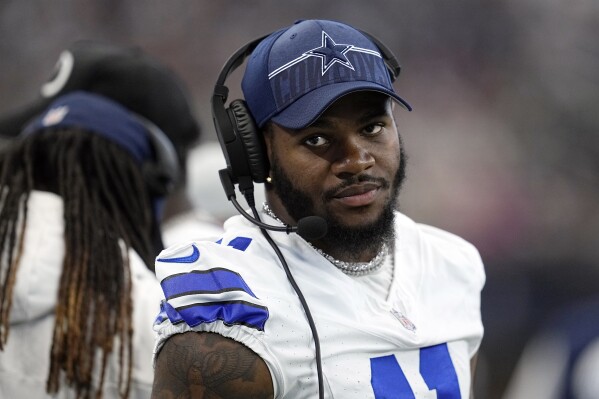 FILE - Dallas Cowboys linebacker Micah Parsons watches from the sideline during a preseason NFL football game against the Jacksonville Jaguars in Arlington, Texas, Saturday, Aug. 12, 2022. The Cowboys open the season on Sunday night at MetLife Stadium in East Rutherford N.J., against the New York Giants. (AP Photo/Tony Gutierrez, File)