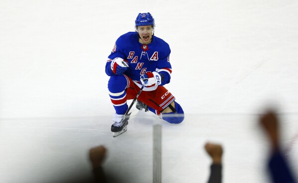 New York Rangers forward Artemi Panarin celebrates his game-tying goal during the third period of an NHL hockey game against the New York Islanders Saturday, April 13, 2024, in New York. (AP Photo/John Munson)