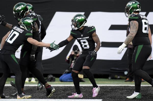 New York Jets wide receiver Elijah Moore (8) celebrates after scoring a touchdown during the first half of an NFL football game against the Philadelphia Eagles, Sunday, Dec. 5, 2021, in East Rutherford, N.J. (AP Photo/Bill Kostroun)