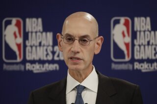 FILE - In this Oct. 8, 2019 file photo, NBA Commissioner Adam Silver speaks at a news conference before an NBA preseason basketball game between the Houston Rockets and the Toronto Raptors in Saitama, near Tokyo. When major corporations have angered Chinese authorities in recent years, the playbook calls for one thing: an apology. The NBA, with billions at stake, has resisted that for now, though some experts wonder if such a move is inevitable. (AP Photo/Jae C. Hong)