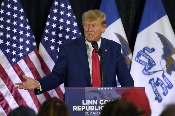 FILE - Former President Donald Trump speaks to campaign volunteers at the Elks Lodge, July 18, 2023, in Cedar Rapids, Iowa. A target letter sent to Donald Trump suggests that a sprawling Justice Department investigation into efforts to overturn the 2020 elections is zeroing in on him. (AP Photo/Charlie Neibergall, File)