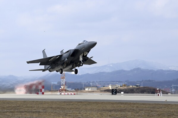 In this photo provided by the South Korea Defense Ministry, a South Korean Air Force F-15K fighter jet takes off from a South Korean Air Force base in Cheongju, South Korea, Friday, Feb. 23, 2024. South Korea and the United States flew advanced stealth fighters in a joint missile-interception drill Friday over the Korean Peninsula, South Korea's air force said, an apparent response to a spate of weapons tests this year by rival North Korea. (South Korea Defense Ministry via AP)