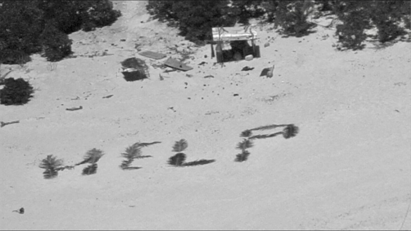 „Hilfe“-Schild an Küstenposten für Piloten der Marine und der Küstenwache für Männer, die auf einem Pazifik-Atoll gestrandet sind